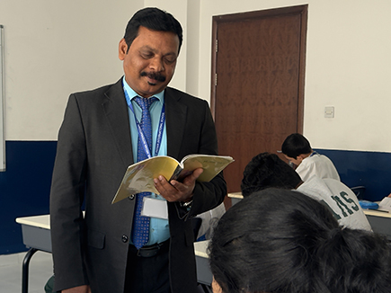 Students contributing articles to school publication